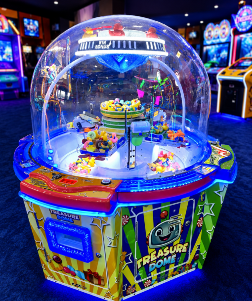 Colorful Treasure Dome arcade prize machine with a clear dome housing spinning toys and blue LED lights.